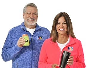 4imprint employees Daryl and Denise wearing and holding Crossland branded products