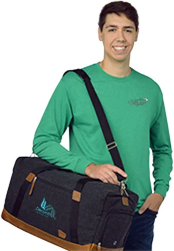 4imprint employee Hunter holding the Field & Co. Campster Wool 22-inch Duffel Bag